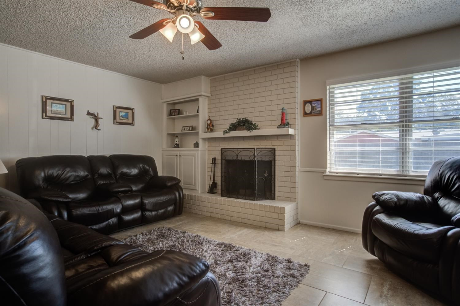 5427 46th Street Lubbock, TX 79414 - Photo 10 of 38 a living room with furniture and a fireplace