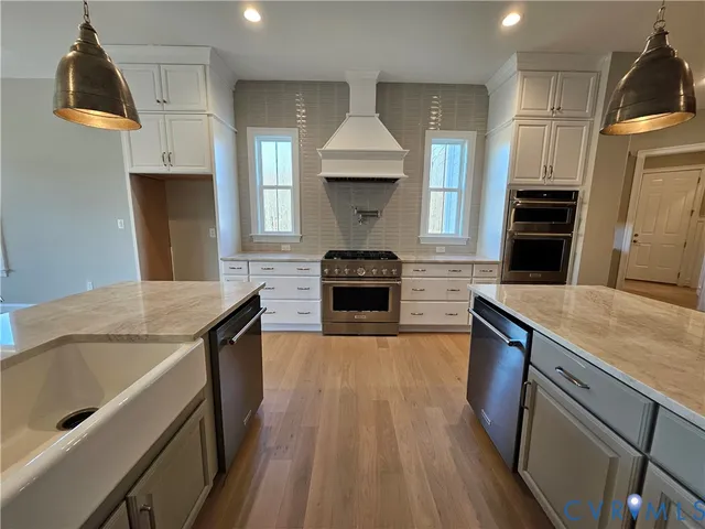 a kitchen with a sink stove and refrigerator