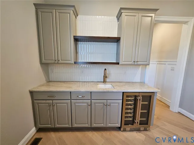 a kitchen with a sink a cabinets and window