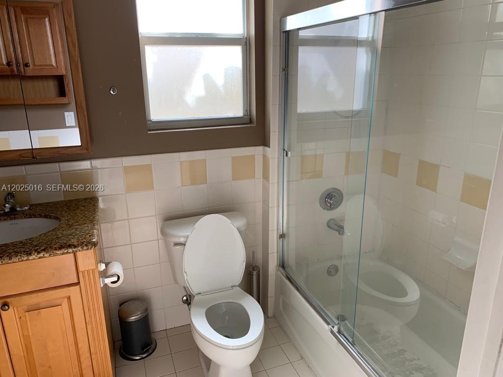 400 Southwest 2nd Street, Unit 201 Miami, FL 33130 - Photo 9 of 12 a bathroom with a toilet and a shower