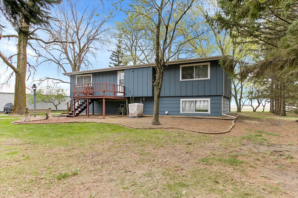 11535 South Kankakee Road Reddick, IL 60961 - Photo 6 of 52 a view of a house with pool and trees in the background