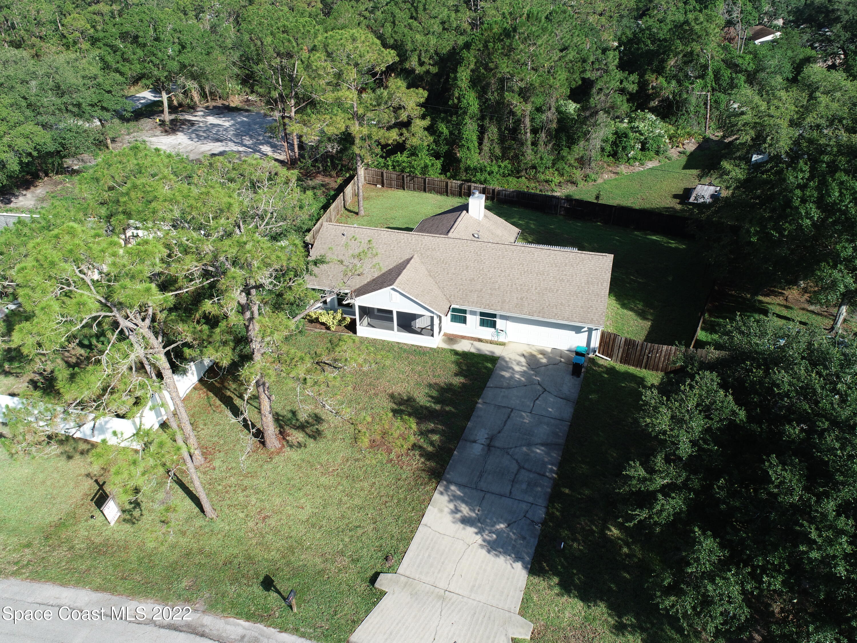 1309 Rascal Street Southeast Palm Bay, FL 32909 - Photo 3 of 17 an aerial view of a house with a yard