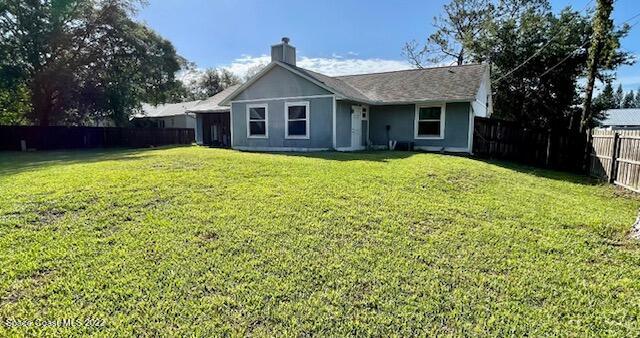 1309 Rascal Street Southeast Palm Bay, FL 32909 - Photo 4 of 17 a view of a house with a backyard