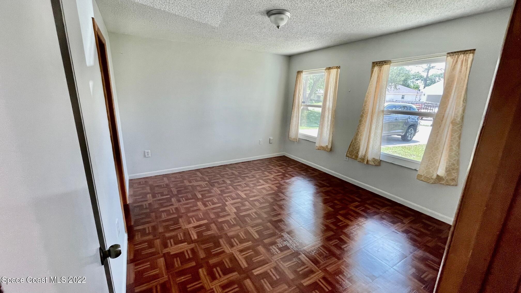 1309 Rascal Street Southeast Palm Bay, FL 32909 - Photo 9 of 17 a view of an entryway with wooden floor