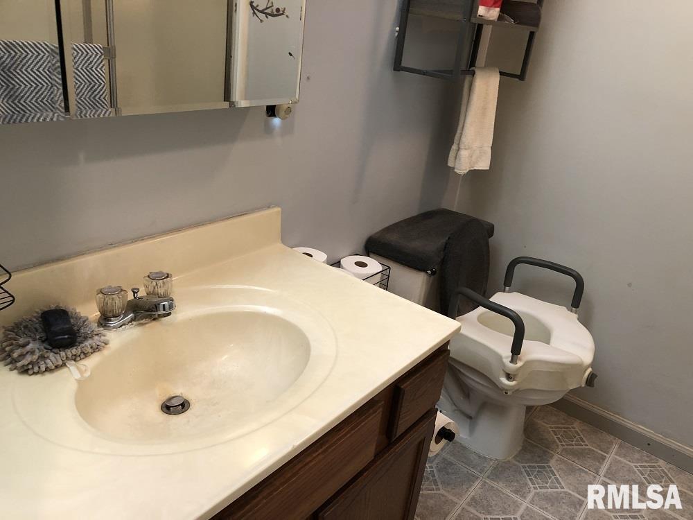 17018 East Thompson Road Opdyke, IL 62872 - Photo 14 of 22 a bathroom with a sink and a toilet