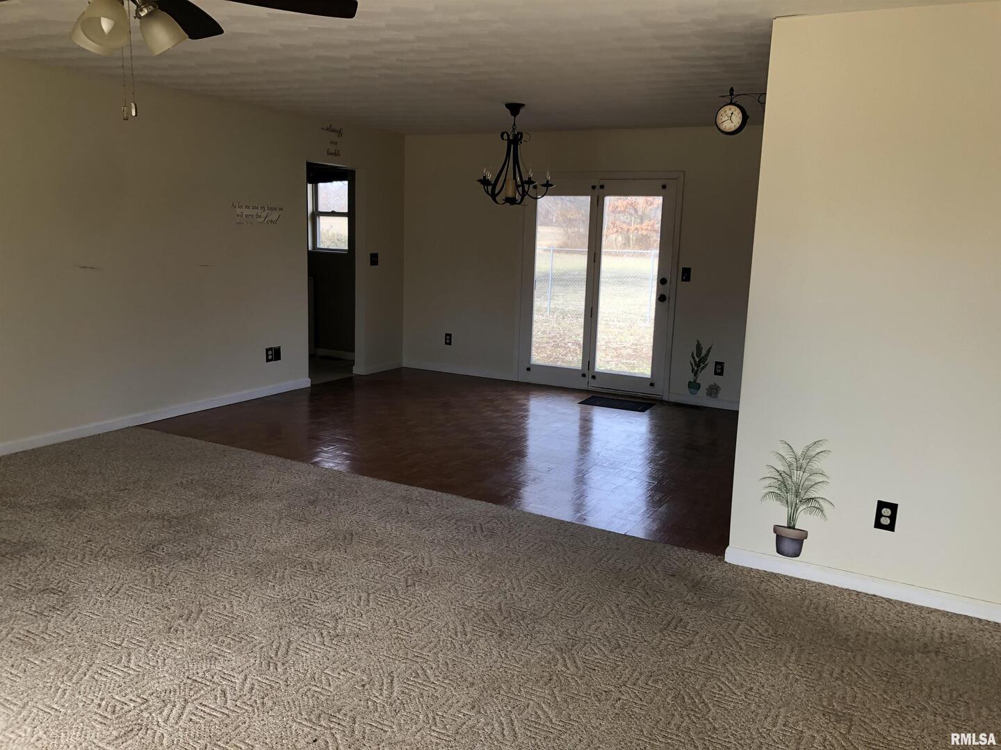 17018 East Thompson Road Opdyke, IL 62872 - Photo 2 of 22 an empty room with windows and cabinet