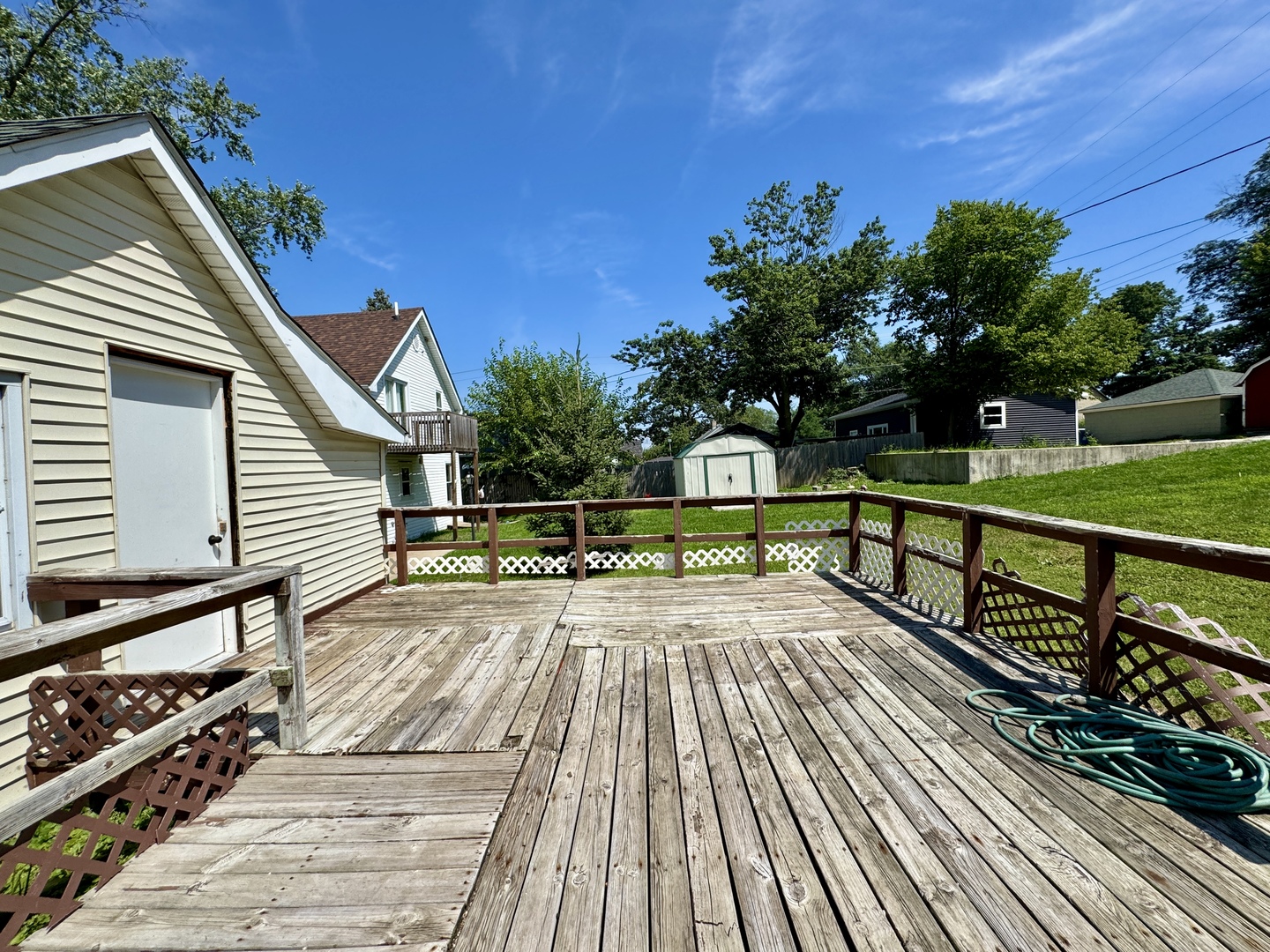 221 East 1st Street Spring Valley, IL 61362 - Photo 16 of 19 a view of a wooden deck with a yard