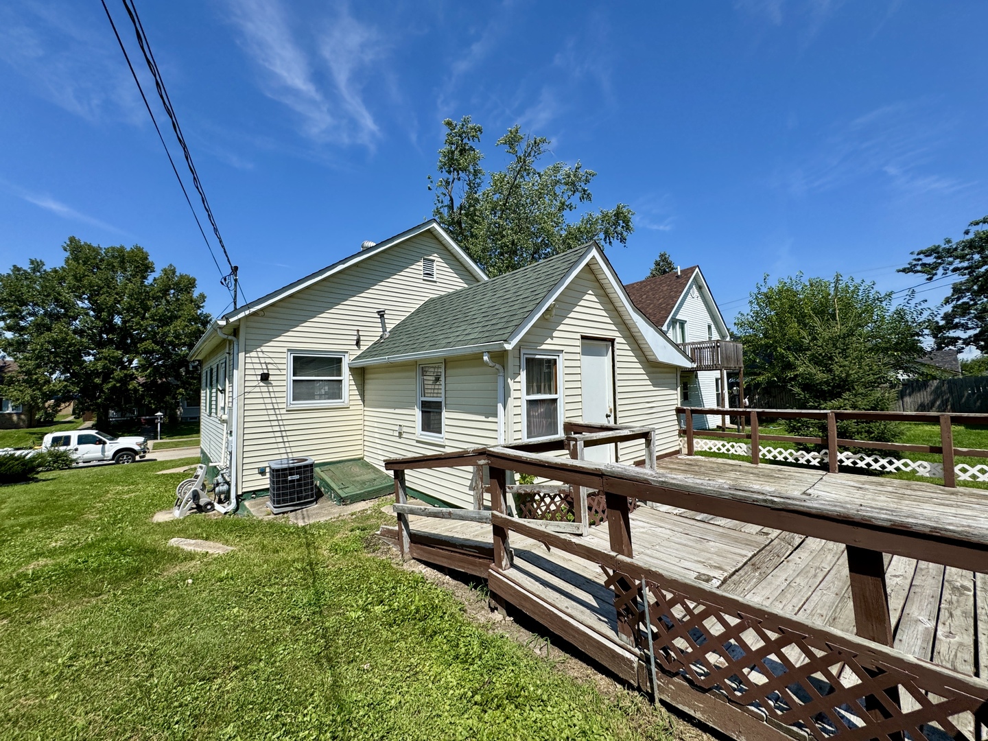 221 East 1st Street Spring Valley, IL 61362 - Photo 18 of 19 a view of a house with wooden deck and furniture