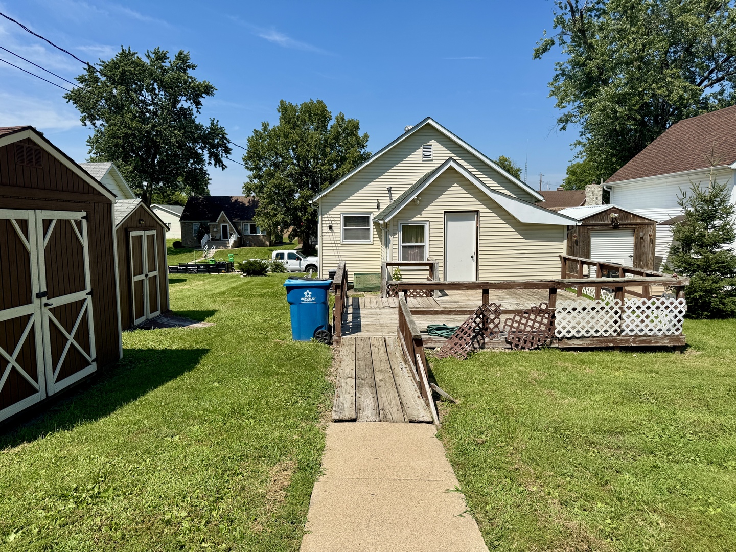 221 East 1st Street Spring Valley, IL 61362 - Photo 19 of 19 a view of a house with a yard and potted plants