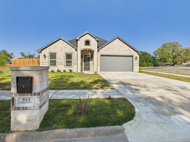 511 Richardson Street Athens, TX 75751 - Photo 3 of 40 View of front of property featuring driveway, brick siding, and an attached garage