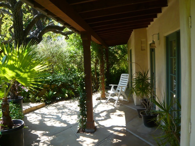 8 San Ysidro Road Montecito, CA 93108 - Photo 2 of 4 a porch with a table and chairs in patio