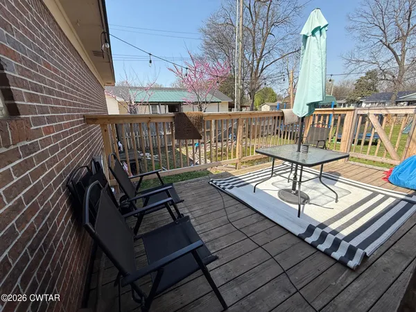 a view of a patio with a bench