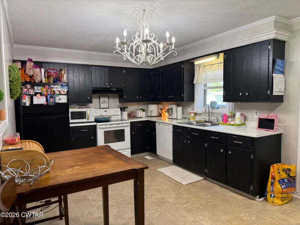 a kitchen with cabinets and appliances
