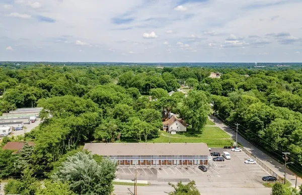 an aerial view of a house with a yard