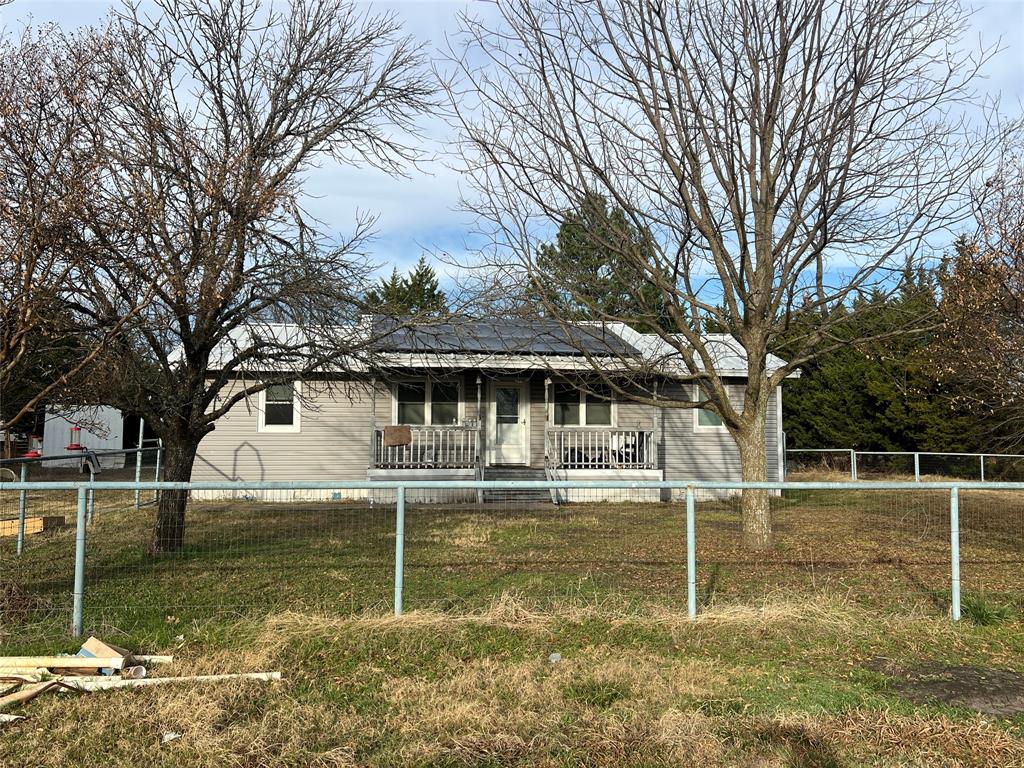 1335 Washburn Road North Bells, TX 75414 - Photo 2 of 12 a front view of a house with a yard