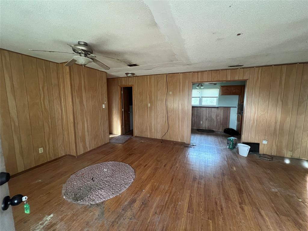 1335 Washburn Road North Bells, TX 75414 - Photo 3 of 12 wooden floor in an empty room with a window