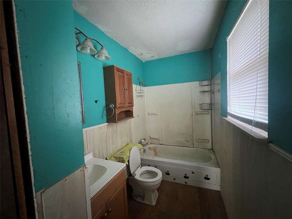 1335 Washburn Road North Bells, TX 75414 - Photo 6 of 12 a bathroom with a sink a toilet and shower