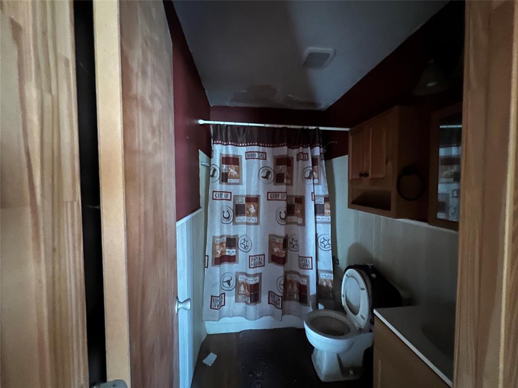 1335 Washburn Road North Bells, TX 75414 - Photo 8 of 12 a room with water heater and wooden walls