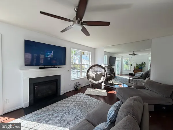 a view of living room with furniture and a flat screen tv