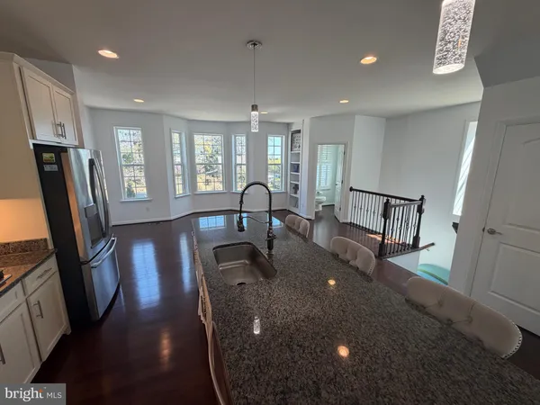 a large kitchen with stainless steel appliances