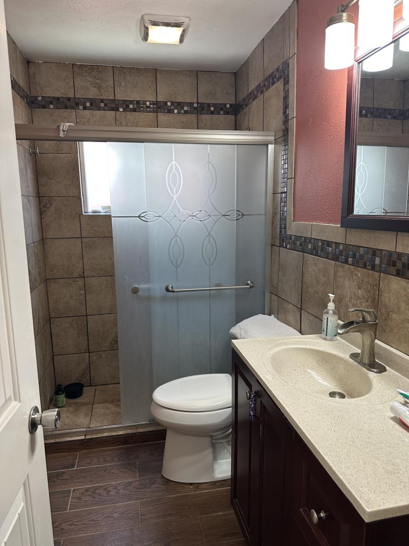 544 Sequoia Road Hayward, CA 94541 - Photo 23 of 34 a bathroom with a sink a toilet a mirror and shower