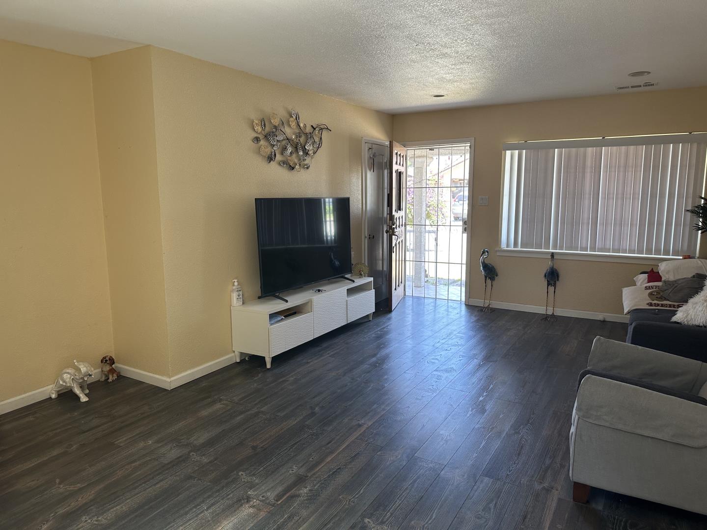 544 Sequoia Road Hayward, CA 94541 - Photo 7 of 34 a living room with furniture and a flat screen tv