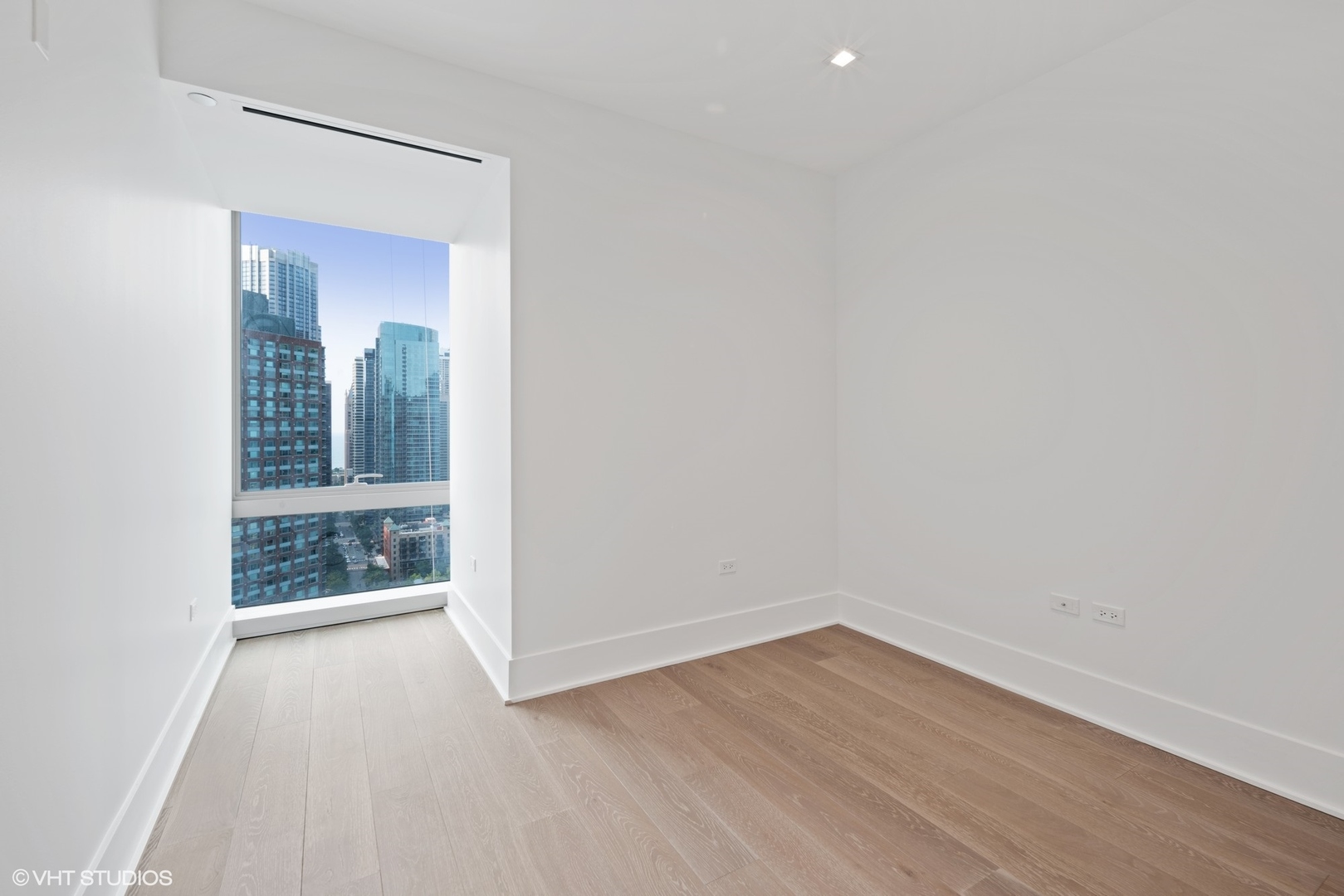 363 East Wacker Drive, Unit 1802 Chicago, IL 60601 - Photo 9 of 15 a view of an empty room with glass door