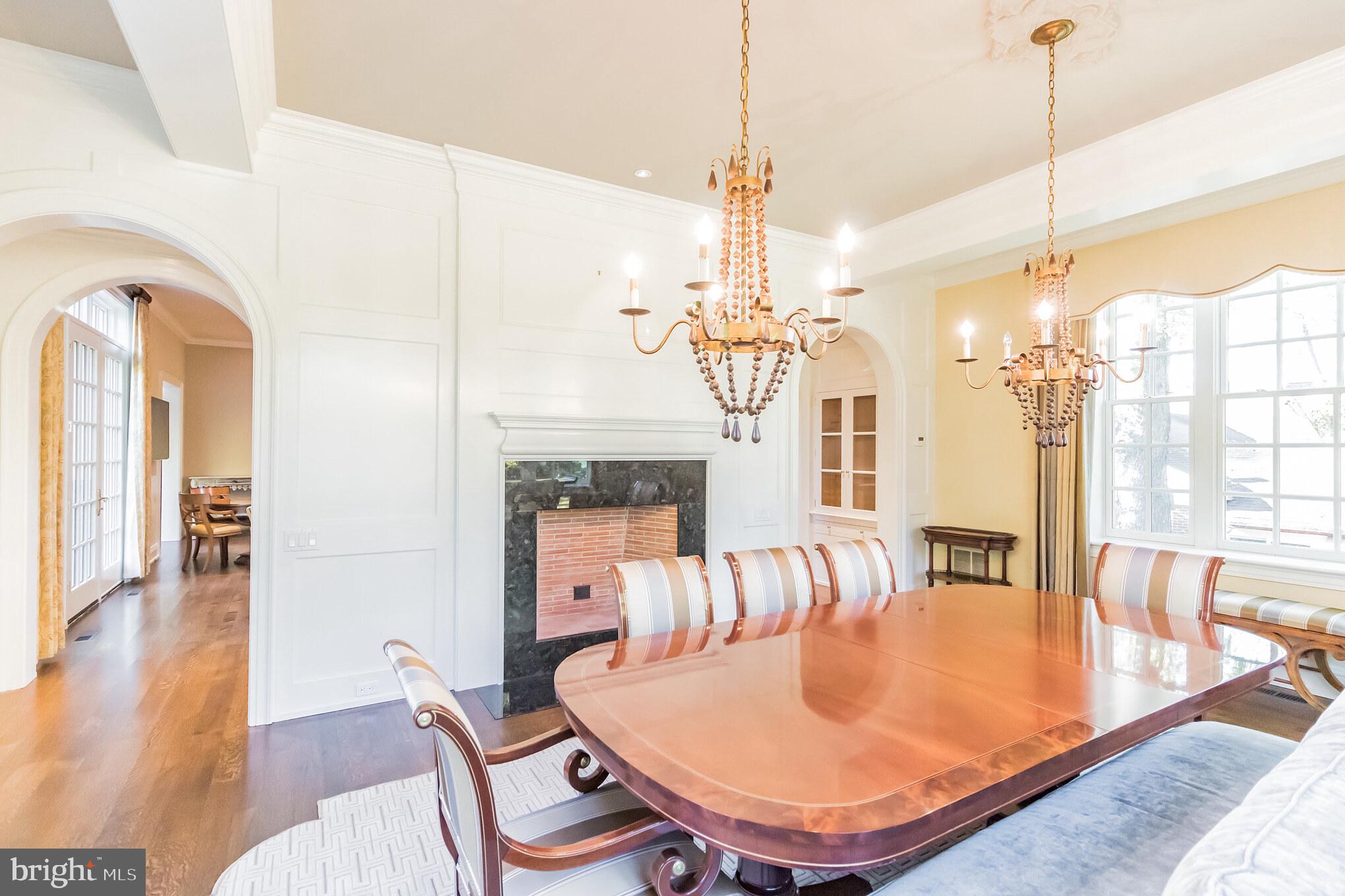 1911 Stone Ridge Lane Villanova, PA 19085 - Photo 11 of 32 a dining room with furniture a chandelier and wooden floor