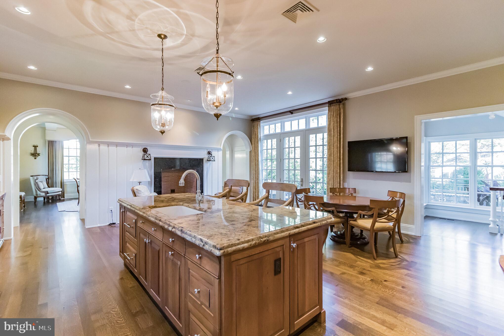 1911 Stone Ridge Lane Villanova, PA 19085 - Photo 14 of 32 a view of a dining room with furniture wooden floor and chandelier