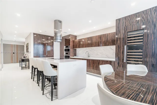a living room with furniture fireplace and a large window