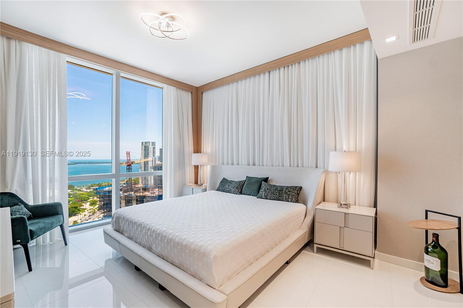 851 Northeast 1st Avenue, Unit 3511 Miami, FL 33132 - Photo 17 of 53 a bedroom with a bed and a window