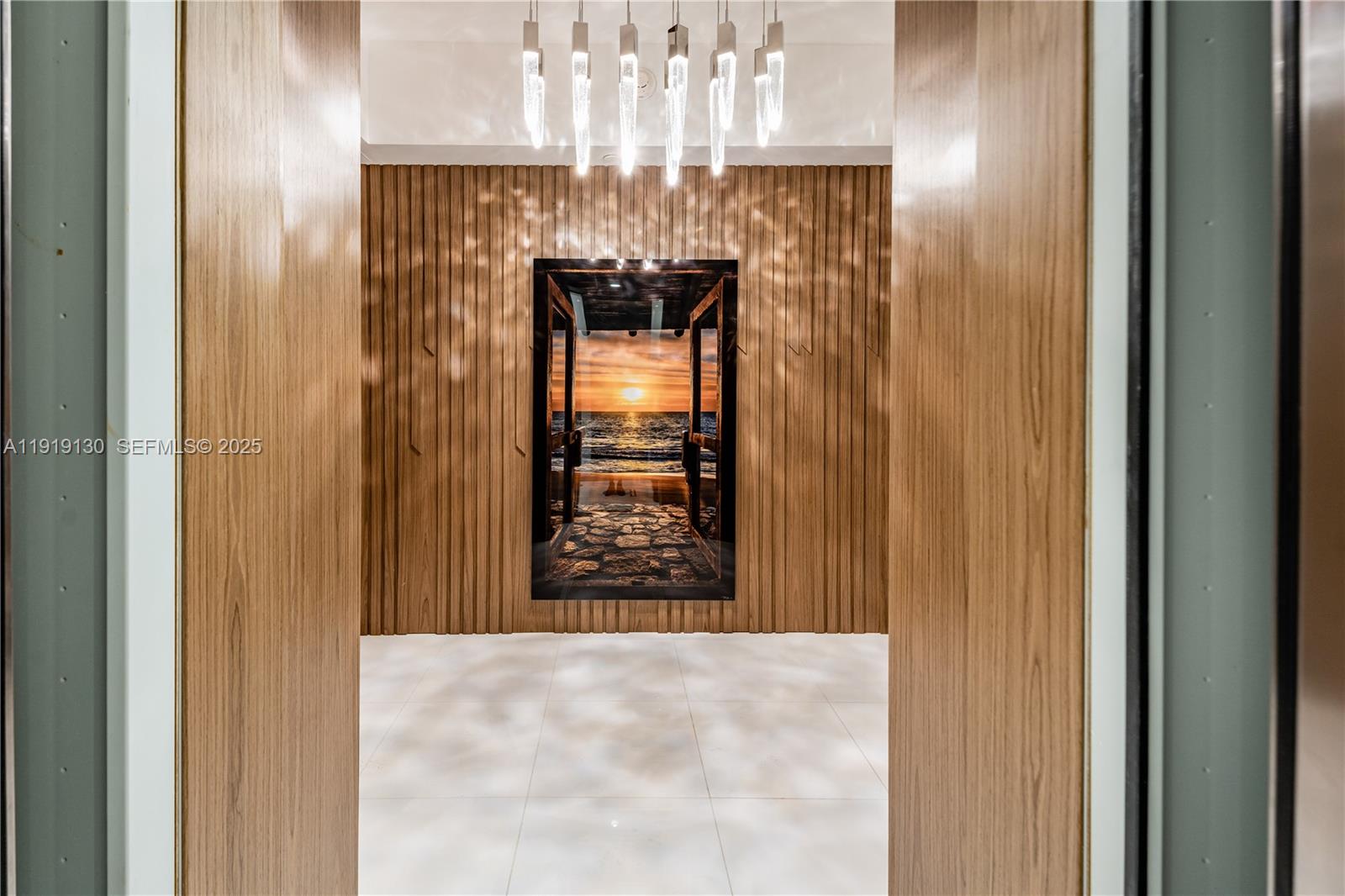 851 Northeast 1st Avenue, Unit 3511 Miami, FL 33132 - Photo 2 of 53 a view of a hallway with chandelier and a door