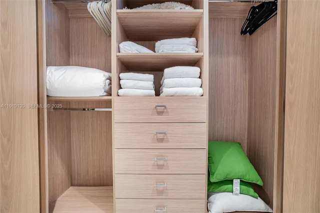 a bedroom with a bed and a mirror