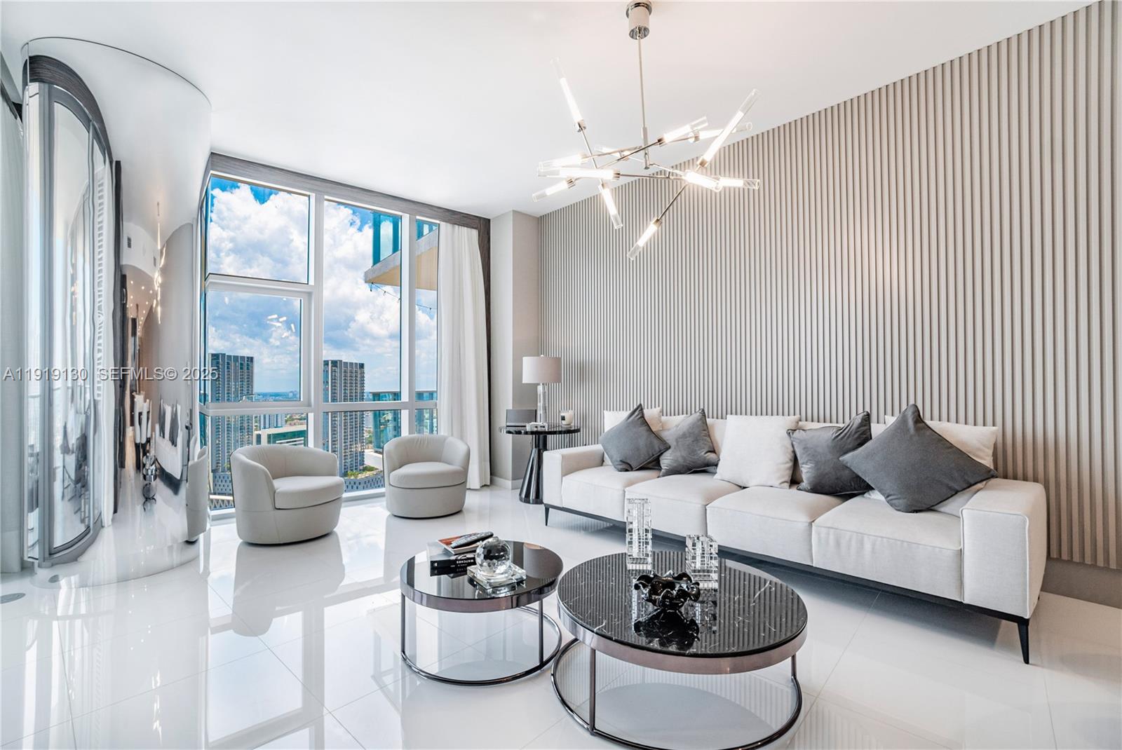 851 Northeast 1st Avenue, Unit 3511 Miami, FL 33132 - Photo 30 of 53 a living room with furniture and a large window