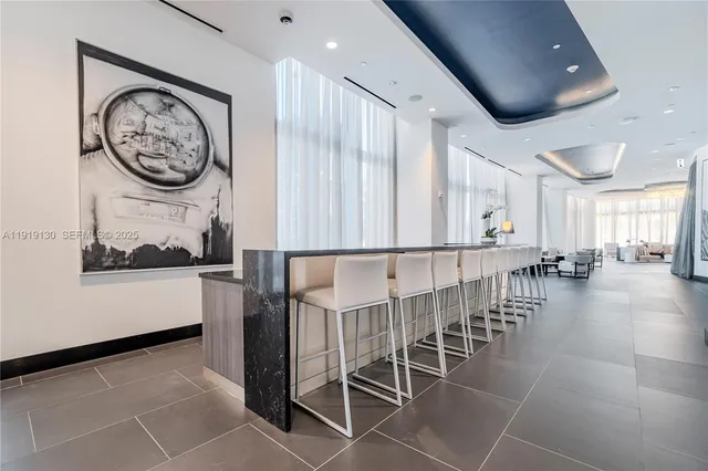 a view of a living room and bedroom