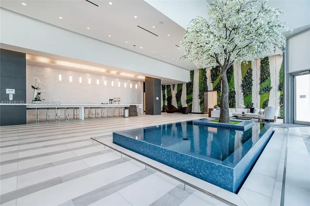 a view of a swimming pool with a table and chairs