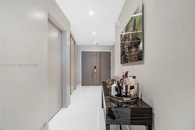 a bedroom with a bed and a curtain