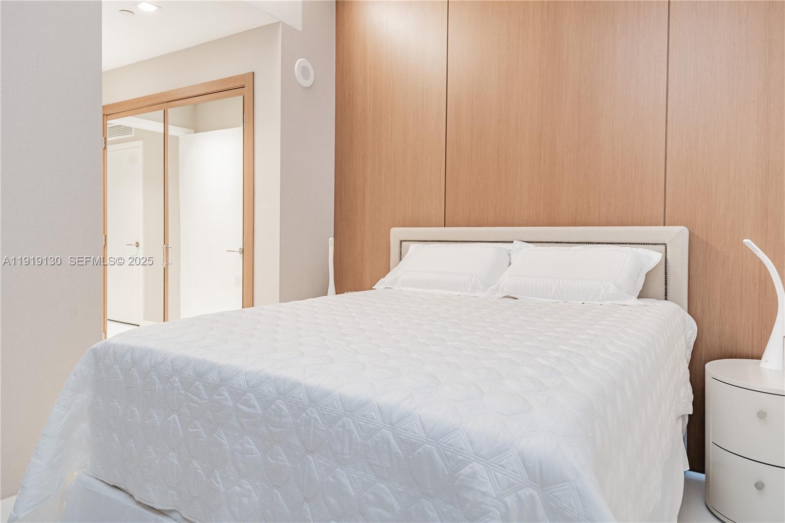 851 Northeast 1st Avenue, Unit 3511 Miami, FL 33132 - Photo 9 of 53 a bedroom with a bed and a window