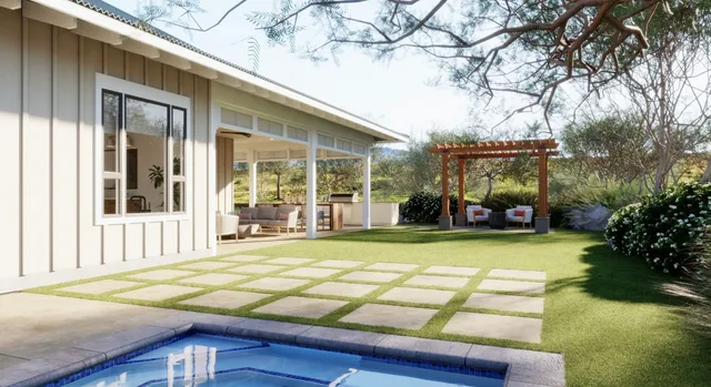 a swimming pool with barbeque oven in front of it