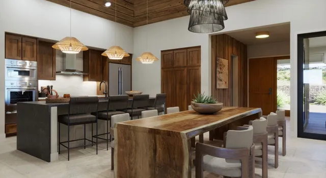 a kitchen with a table and chairs in it