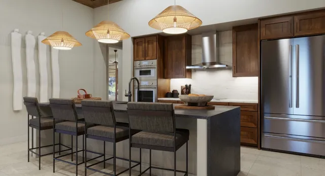 a kitchen with stainless steel appliances a dining table and chairs