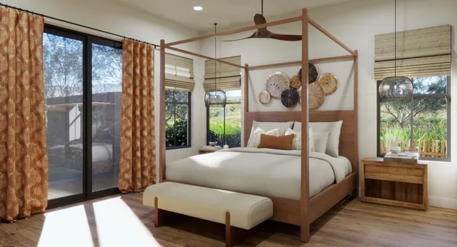 a bedroom with a bed couch and a window