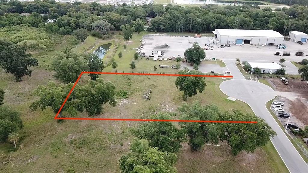 1080 Duck Box Road Umatilla, FL 32784 - Photo 1 of 8 an aerial view of a house with outdoor space