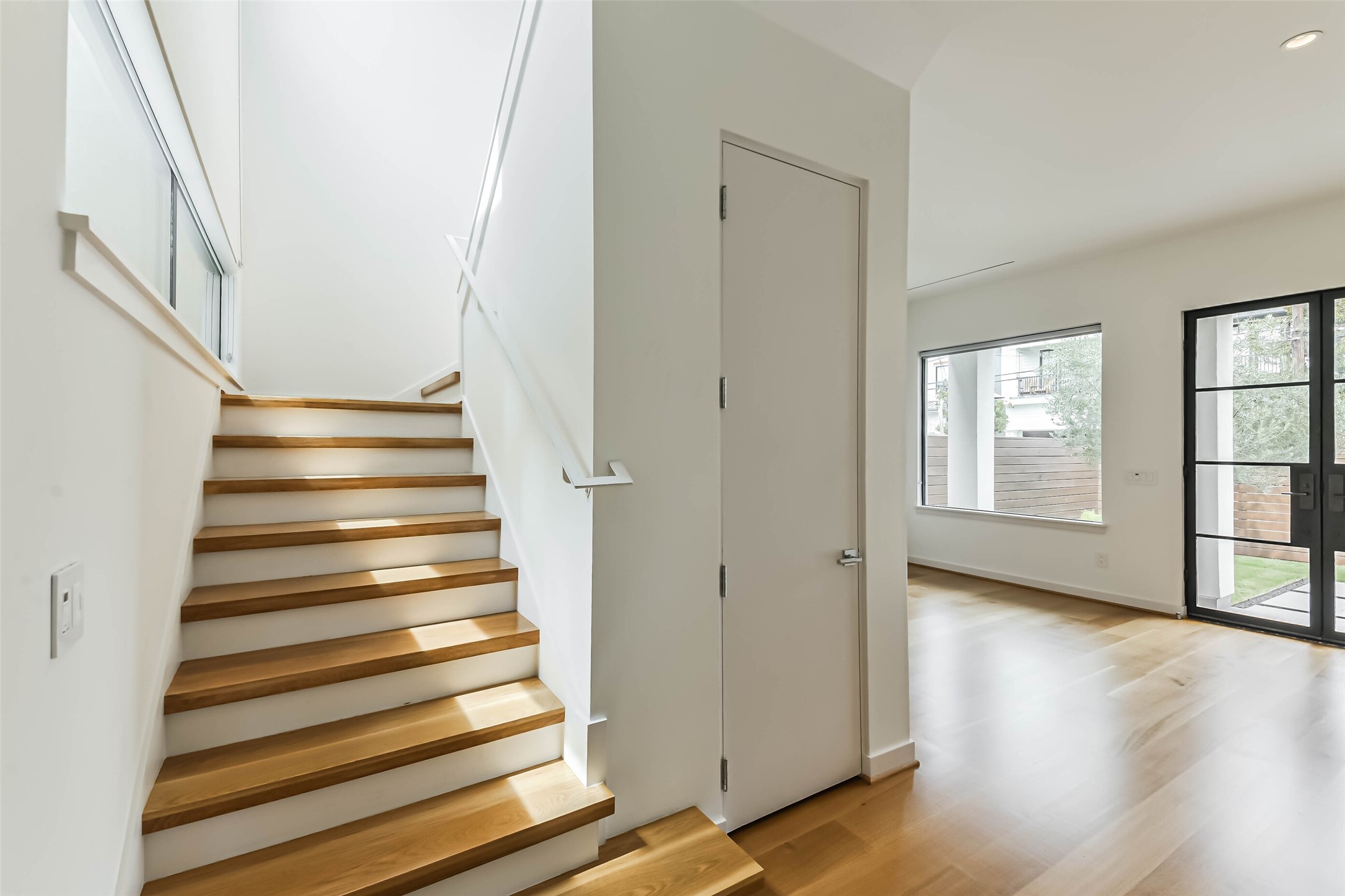 815 Alexander Street Houston, TX 77007 - Photo 7 of 49 Open staircase with hardwood flooring