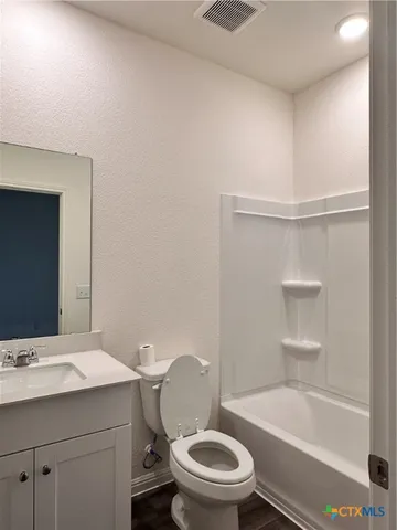 a bathroom with a sink a toilet and bathtub