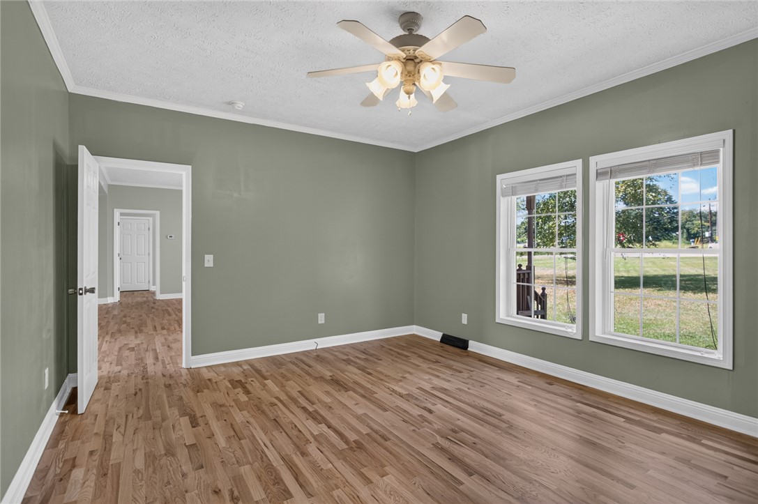 564 Fairfield Road Walhalla, SC 29691 - Photo 17 of 50 Hardwood floors and classic crown molding define this versatile living space.