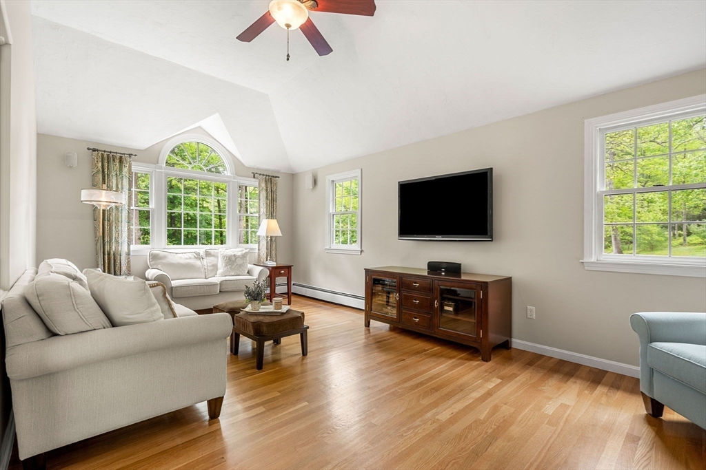 28 Charles Road Groton, MA 01450 - Photo 14 of 42 a living room with furniture and a flat screen tv