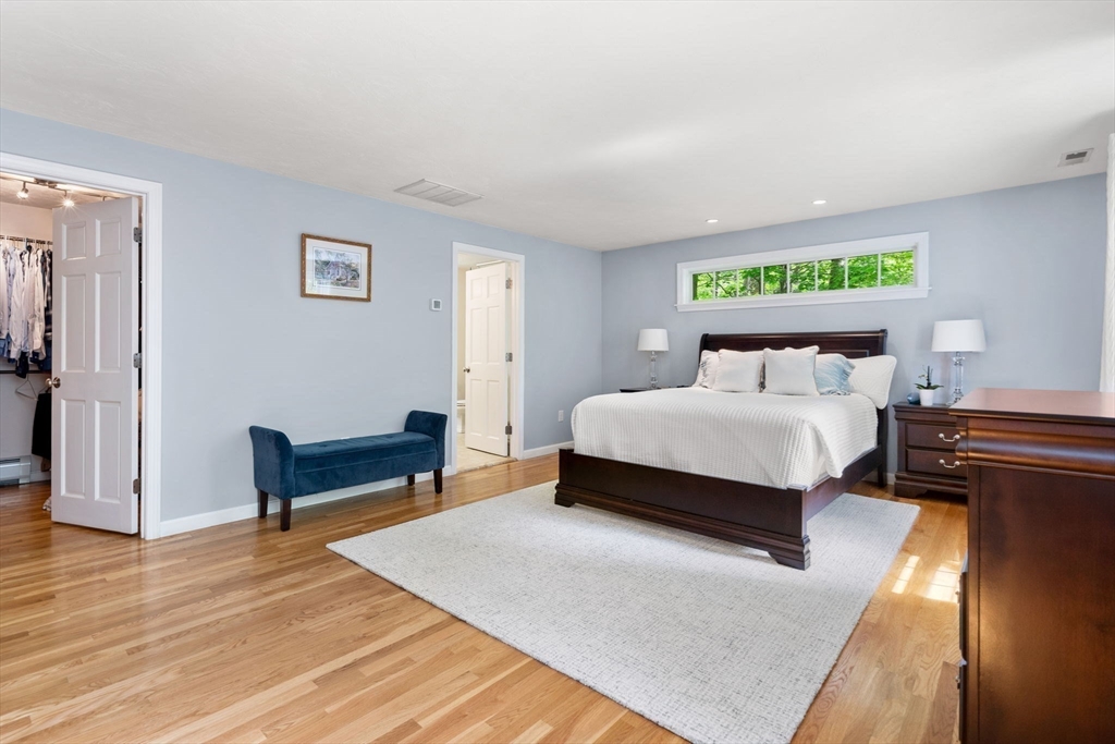 28 Charles Road Groton, MA 01450 - Photo 19 of 42 a bedroom with a bed and a table