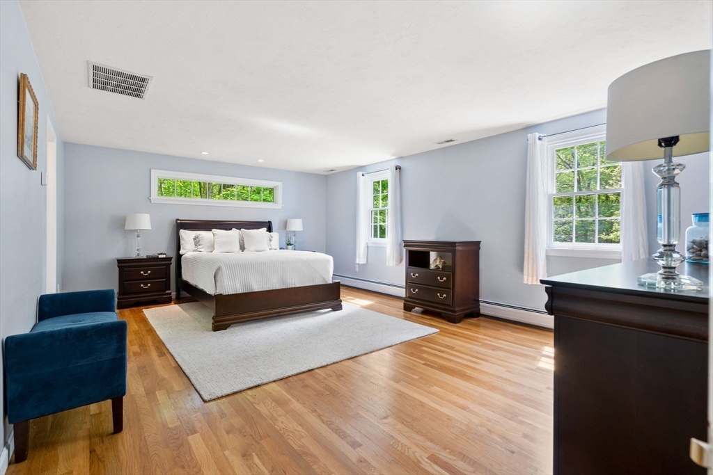 28 Charles Road Groton, MA 01450 - Photo 20 of 42 a bedroom with a bed and a window