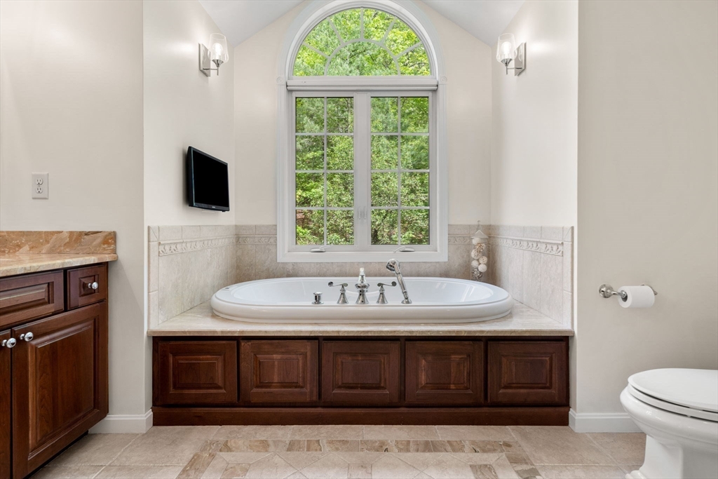 28 Charles Road Groton, MA 01450 - Photo 22 of 42 a bathroom with a sink double vanity and a toilet